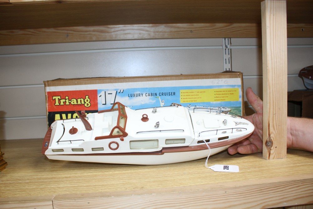 A Tri-ang Avon 17 inch electric motor luxury cabin cruiser model, boxed, together with a Tri-ang enamelled metal model of a yacht, 26.5